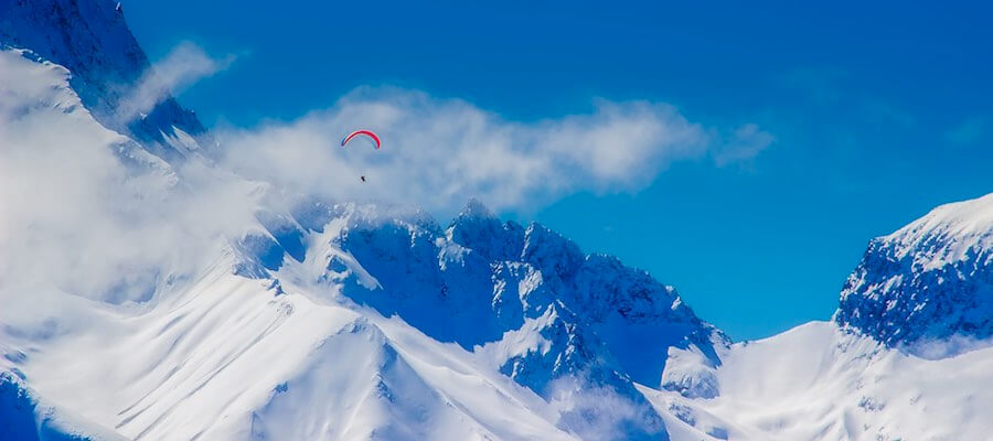Snowy mountaintop parachute